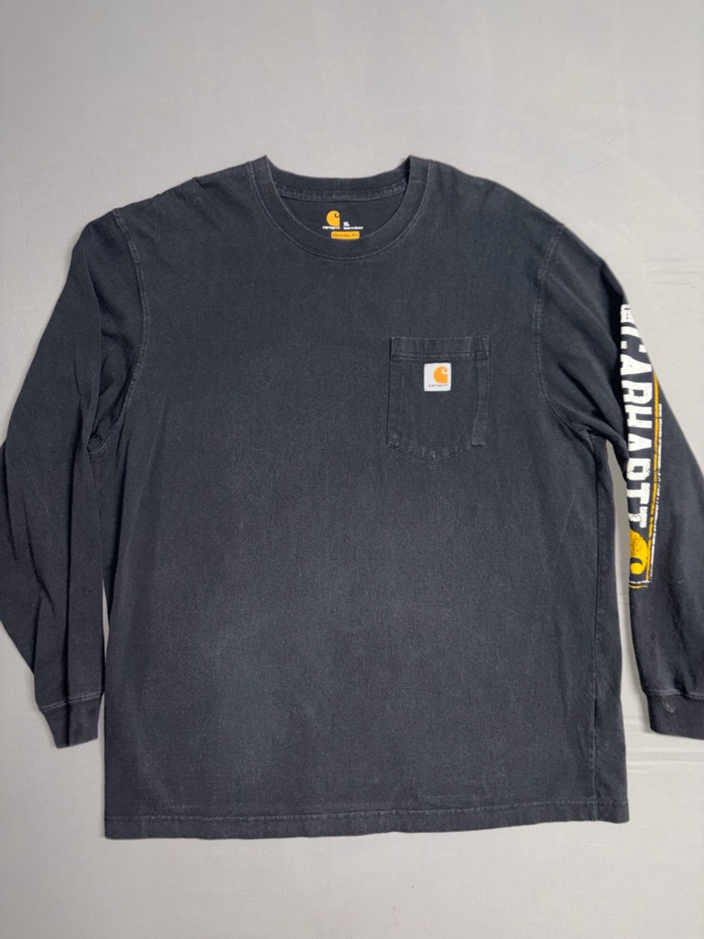 Carhartt Black Long-Sleeve Pocket Tee with Yellow Logo Accent